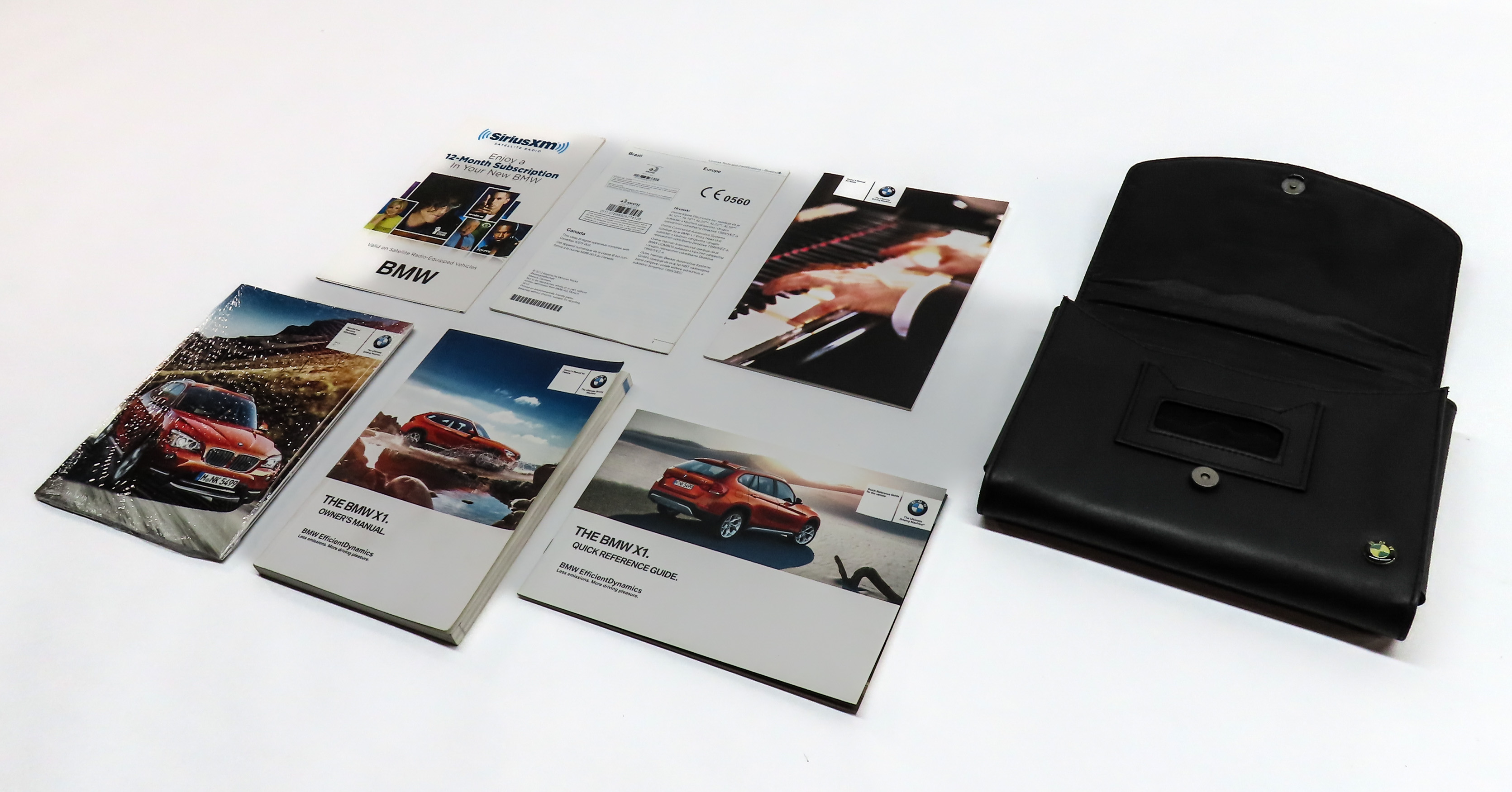 2013 BMW X1 (E84) 2.0L (N20) ENGINE OWNER'S MANUAL BOOKLET SET/7 w/ CASE (BLACK) — exact item pictured